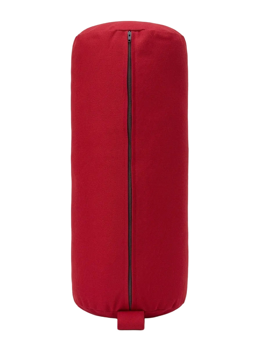 A red cylindrical yoga bolster cover with a central black zipper and a small red handle at the bottom, shown against a plain white background.