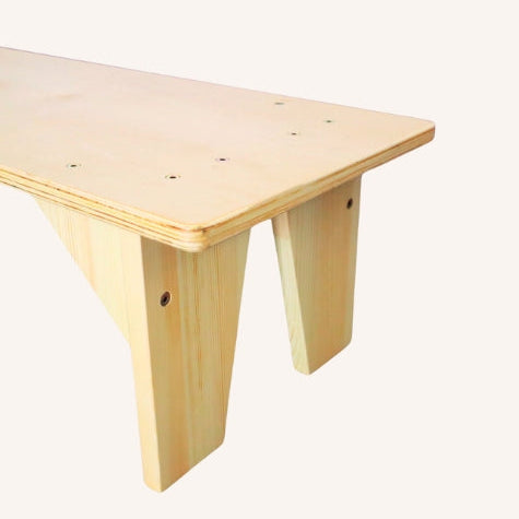 Wooden yoga bench on a white background