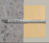 Metal drill bit on a textured gray surface with a yellow square background