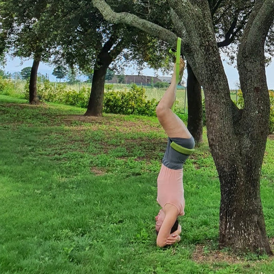 The Benefits of Suspended Sirsasana: From Ropes to Portable Yoga Slings