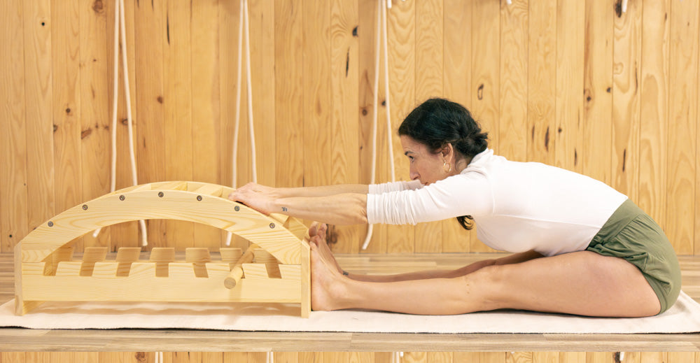 yoga forward bend with viparita dandasana bench