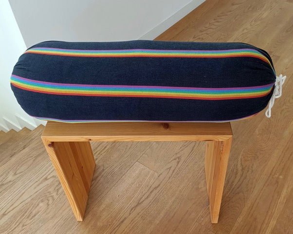 black rainbow stripes iyengar bolster on wood halasana box