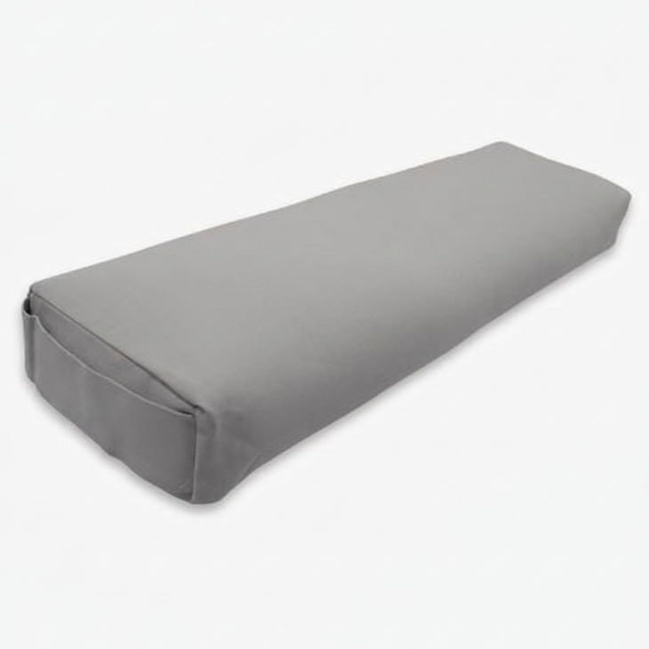 A rectangular gray pranayama pillow with a smooth fabric surface, shown at an angle on a plain white background.