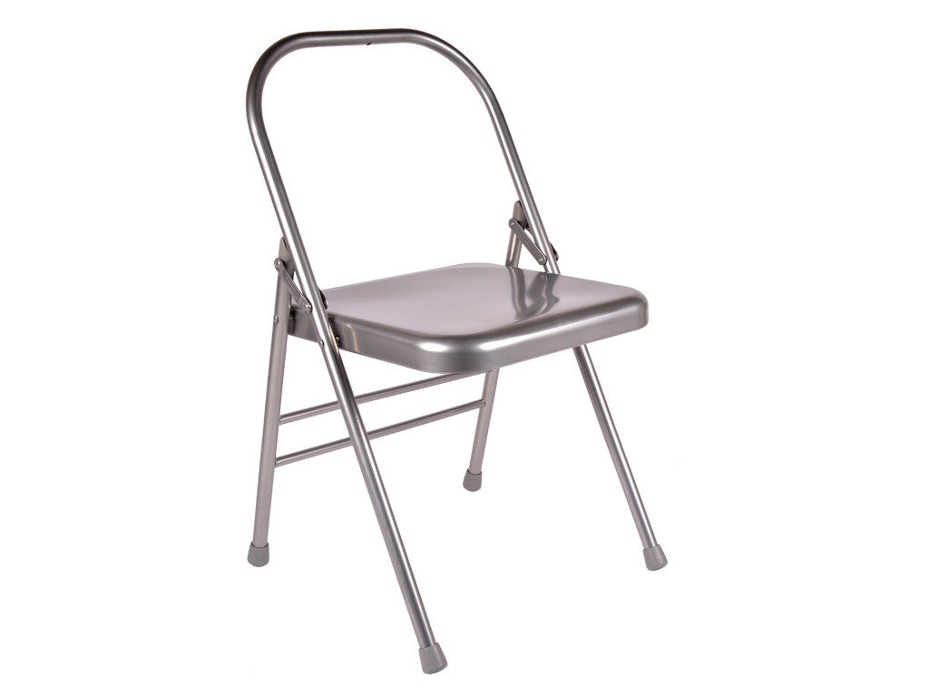 Metal folding yoga chair on a white background