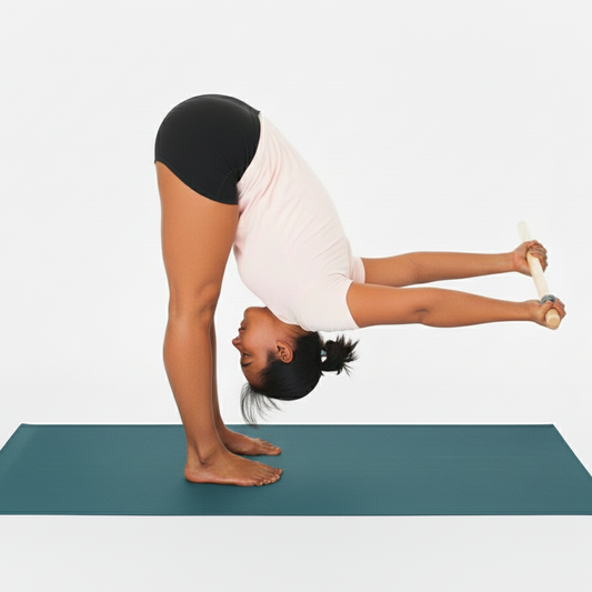 Person performing a yoga pose using a wood yoga stick